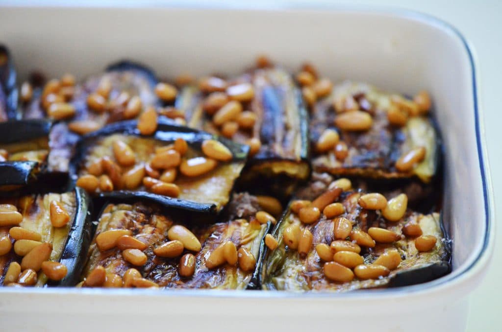 Pine nuts on eggplant