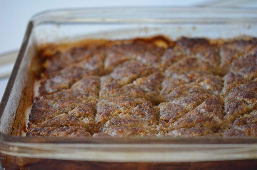 Baked kibbeh in a glass baking dish, cut in decorative squares, Maureen Abood
