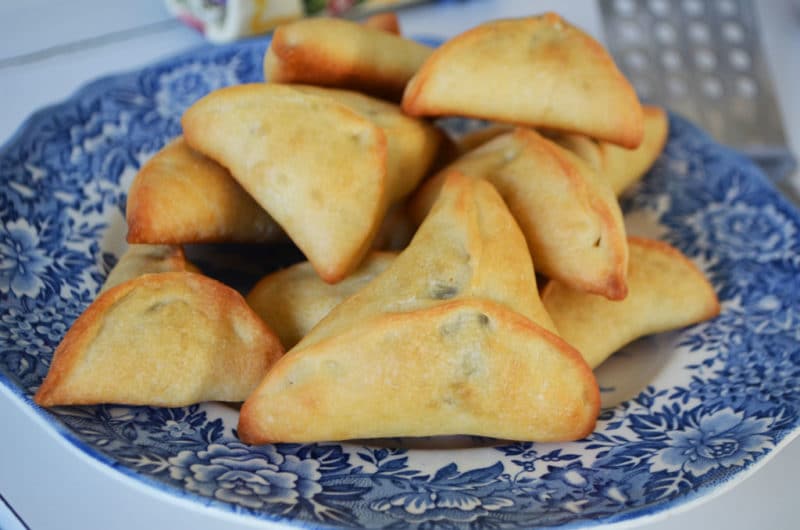 Fatayar platter Lebanese spinach pies on a vintage blue plate, by Maureen Abood.com