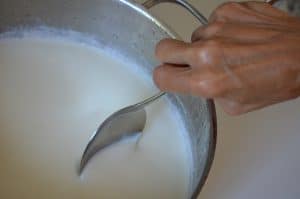 A spoon in a pot of yogurt