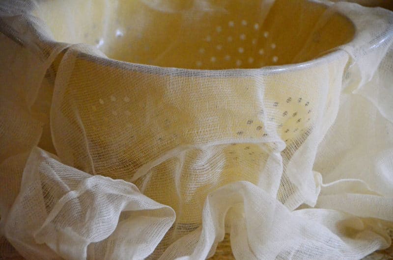 Cheesecloth over yellow strainer, Maureen Abood