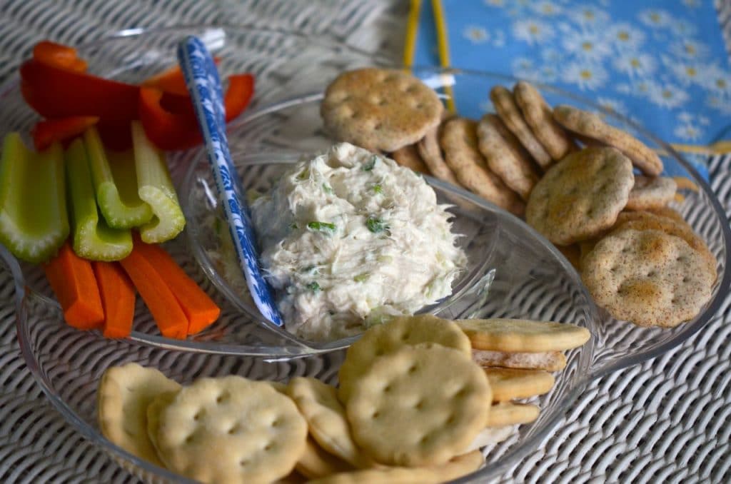 Smoked whitefish dip in a platter with crackers and vegetables