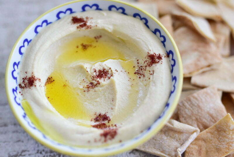 Smooth Hummus with olive oil and pita chips