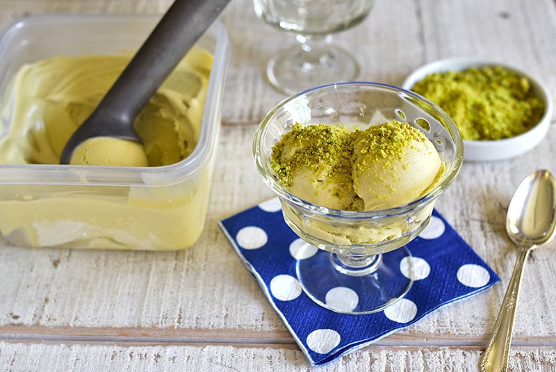 Pistachio gelato is served from the tub with crushed pistachios on top, in a footed dish, MaureenAbood.com