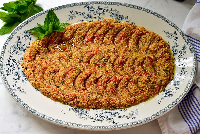 Tomato kibbeh on a blue and white platter with mint and olive oil, Maureen Abood