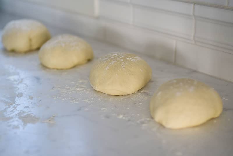 Dough balls for za'atar flatbread with flour on the counter, Maureen Abood
