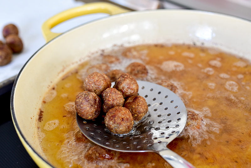 Kibbeh balls in the frying pan, Maureen Abood