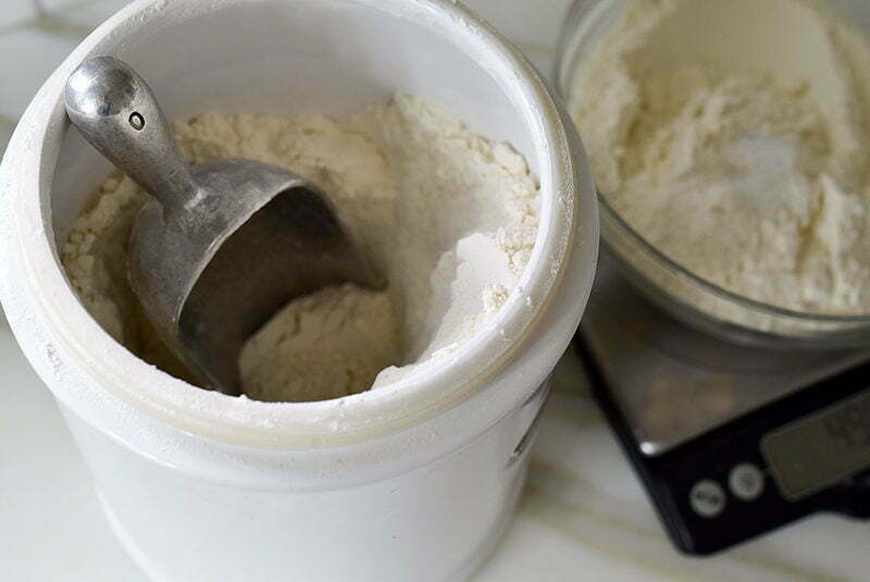 Flour scoop in a white cannister