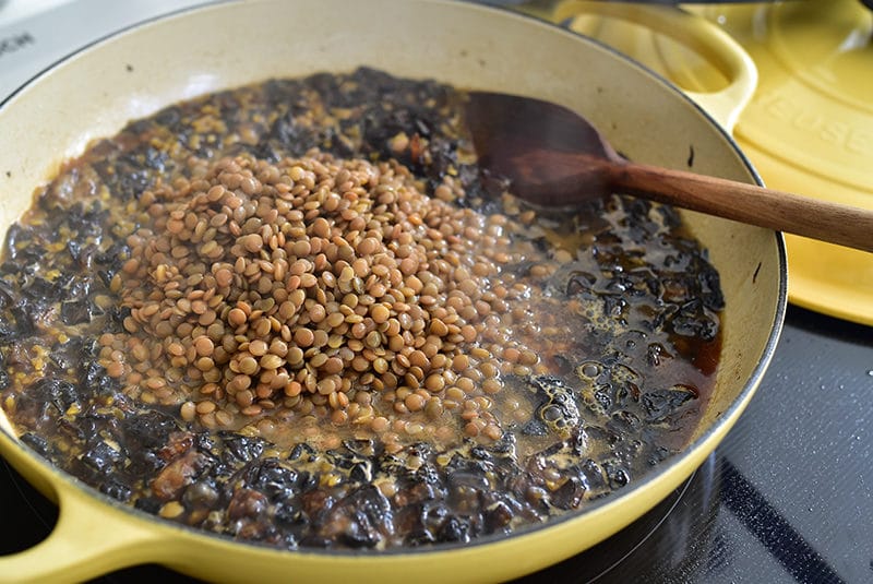 Lentils and onions cooking for mujadara