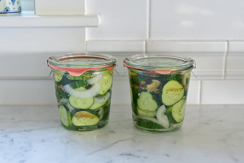 Bread and butter pickles in Weck jars on the counter