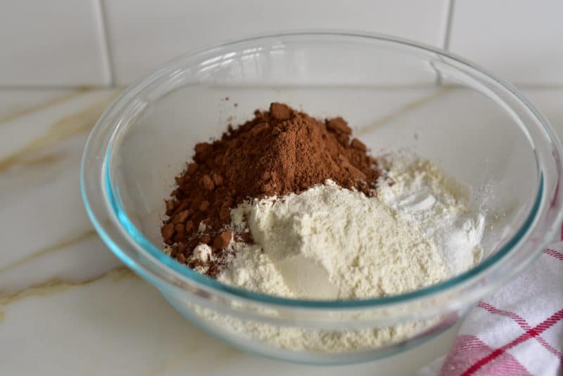 Ingredients for chocolate crinkle cookies in a bowl