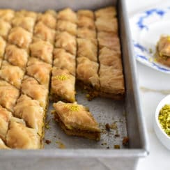 Pistachio baklawa made with olive oil, cut in pieces in the pan