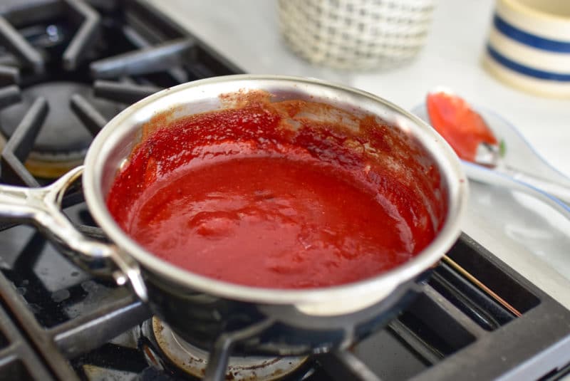 Strawberry puree cooking on the stove