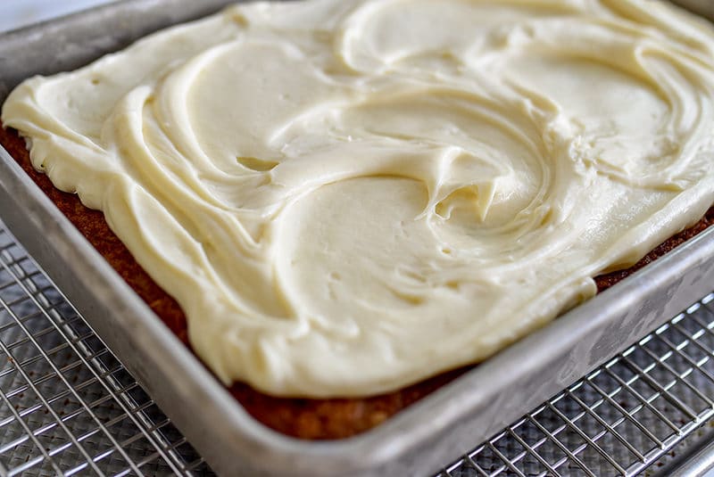 Olive Oil Carrot Cake with Cream Cheese buttercream in a pan
