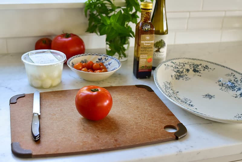A red tomato on a cutting board