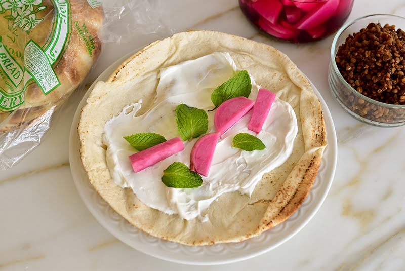 Labneh, pink turnips and mint on a pita
