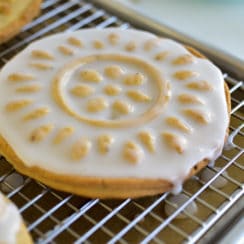 White iced shortbread cookie on a cookie rack