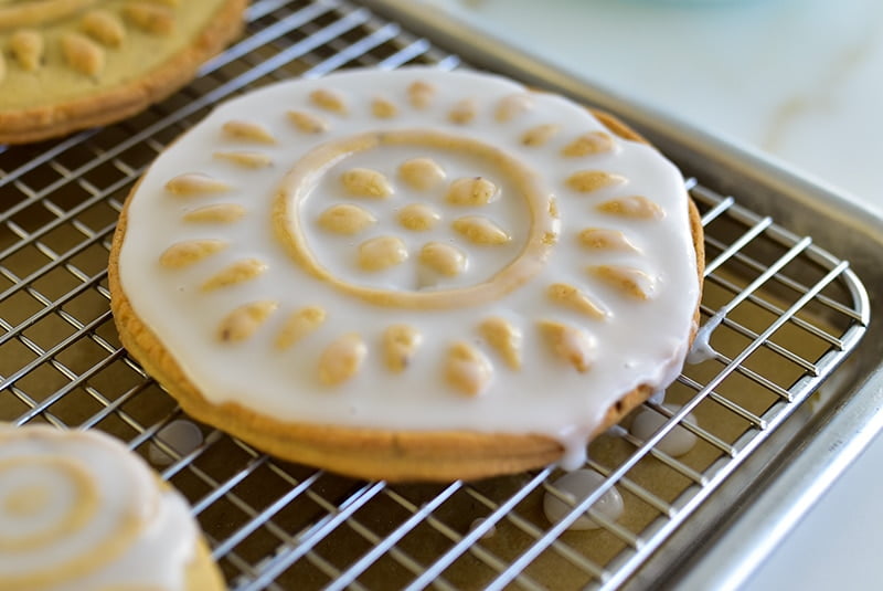 White iced shortbread cookie on a cookie rack