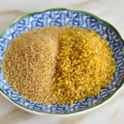 Fine and coarse bulgur side by side in a blue bowl