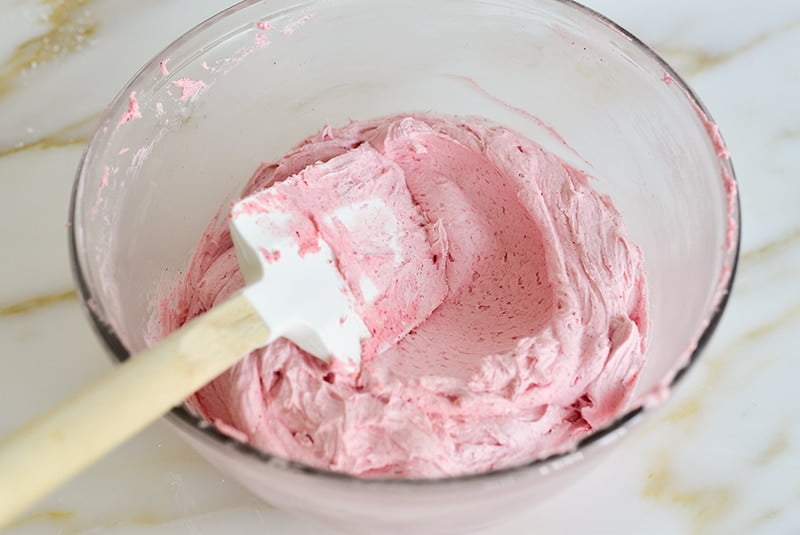 Pink raspberry buttercream in a bowl