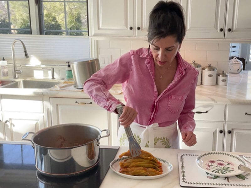 Maureen takes cabbage rolls out of a pot
