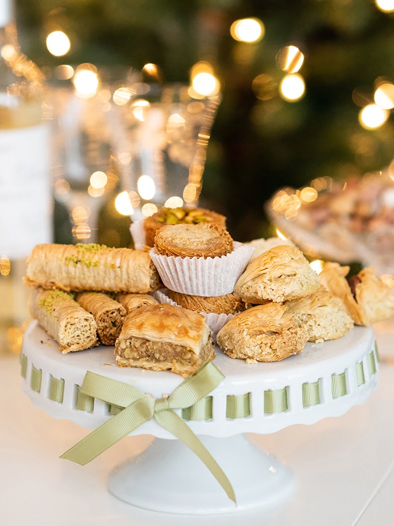 Baklawa on a platter with holiday lights