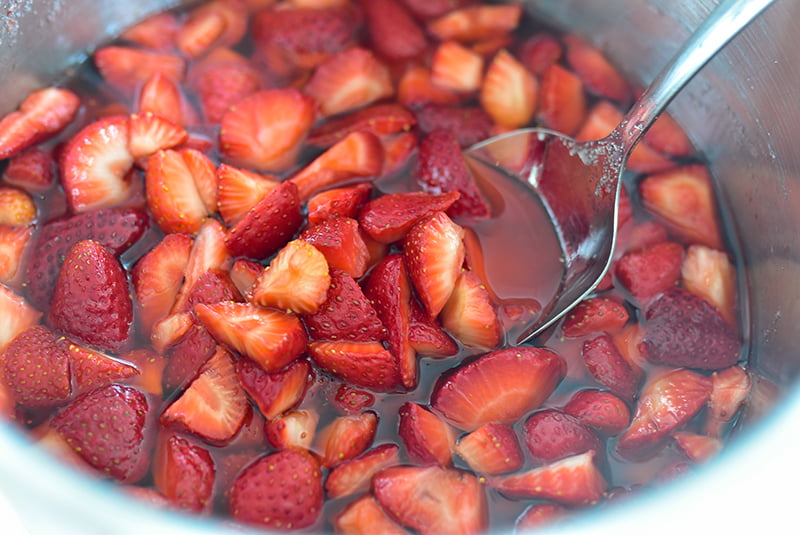 Strawberries cooking in a pot