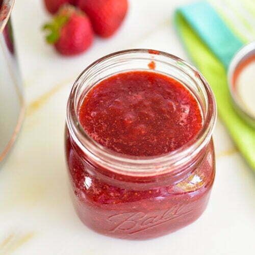 Strawberry jam jar with berries