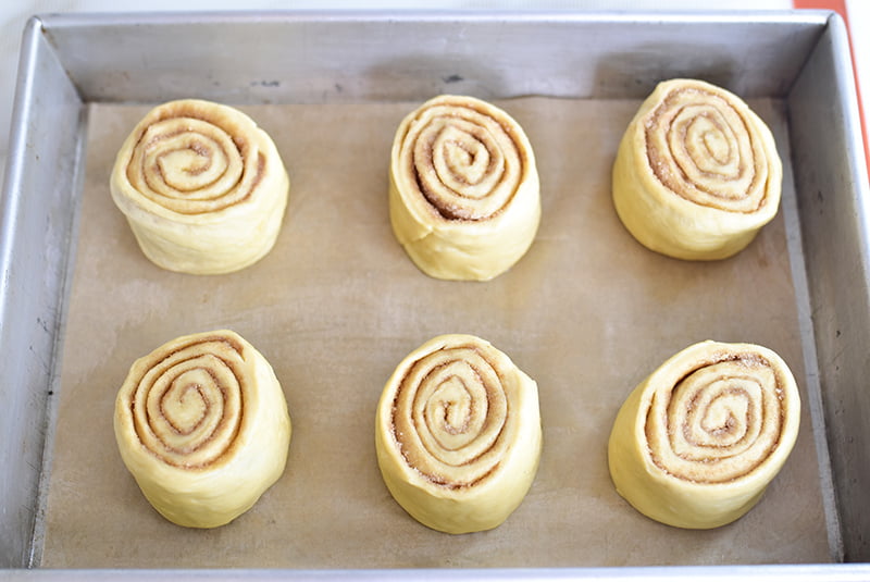 Cut rolls in a pan before rising for cinnamon rolls